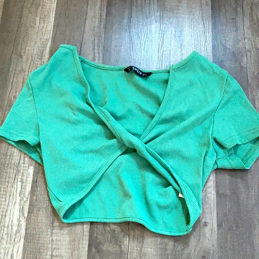 this shirt is from shein. it’s a very pretty green color, and it’s an XS.